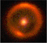 Vzdálená trpasličí galaxie zobrazená díky gravitační čočce