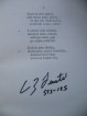 Stránka s prvními verši Písní kosmických podepsaná A. Feustelem