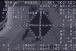 Zaměřovací kříž ISS kamerou lodi Progress, údaje na obrazovce jsou generovány systémem Kurs-NA. Autor: NASASpaceFlight.com