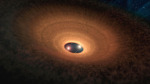 Blikající hvězdný systém YLW 16A obklopený protoplanetárním diskem Autor: NASA/JPL-Caltech/R. Hurt (IPAC)