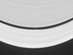 23.05.2005 - Měsíc čeřící vlny v Saturnových prstencích