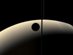 11.07.2006 - Srpek měsíce Rhea zakrývá srpek Saturnu