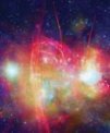 Autor: NASA, CXC, UMass and D. Wang et al.; Radio: NRF, SARAO and MeerKAT - Střed Galaxie (Mléčné dráhy) v rentgenovém oboru (modré a zelené odstíny) a rádiovém oboru (červeně). Nachází se zde velké množství hvězd, prachu a plynu v okolí supermasivní černé díry Sagittarius A*.