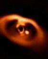 Autor: ESO/A. Müller et al. - Snímek mladé planety PDS 70b pořízený přístrojem SPHERE