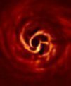 Autor: ESO/Boccaletti et al. - Vnitřní část disku kolem hvězdy AB Aurigae na snímku z přístroje VLT/SPHERE