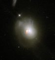 Autor: ALMA (ESO/NAOJ/NRAO)/S.Dagnello - Snímek PSB galaxie kombinující data z HST a ALMA s rozlišitelným plynem