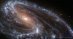 Neobvyklá spirální galaxie M66 z Webba