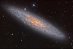 NGC 253: Prašný vesmírný ostrov